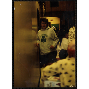 A girl walking against a wall during a Boys and Girls Club event