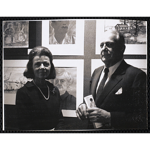 Frederic C. Church, former president of the Boys' Clubs of Boston, poses with his wife at the Boys' Clubs of Boston Tri-Club Art Exhibit at the Museum of Science