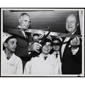 Overseer Forrester A. Clark (left) and Executive Director of Boys' Club of Boston Arthur T. Burger (right) participate with James Collins (center) and three other members of the Tom Pappas Chefs' Club in a ribbon cutting