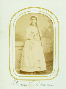 Full-length studio portrait of Alice L. Bowen, standing, facing left, location unknown