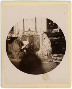 C. P. Blanchard and Abby F. Blanchard seated on the parlor floor, wearing kimonos