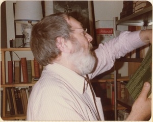 Leonard Baskin perusing books at the Common Reader Bookshop