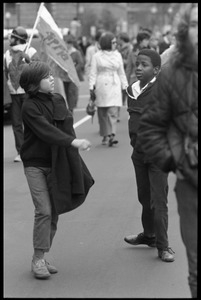 Two young boys at the Counter-inaugural demonstrations, 1969, a Yippie flag in the background