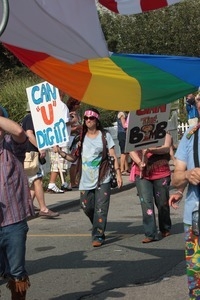 Parade marcher with sign reading 'Can you dig it?' : Provincetown Carnival parade