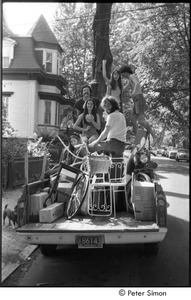 Elliot Blinder, Harry Saxman, Stephen Davis, and three unidentified women in the back of a pickup truck, likely headed to Tree Frog Farm commune