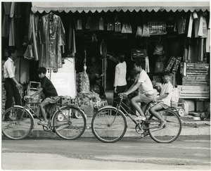 Boys cycling through town