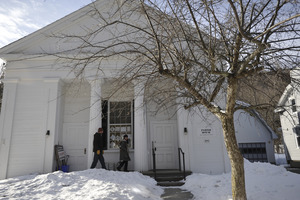 Aftermath of the Congregational Church fire in West Cummington, Mass.: exterior view of parishioners entering the Parish House