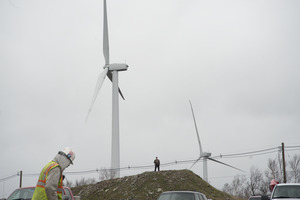 Construction worker walking near wind turbines, Berkshire Wind Power Project