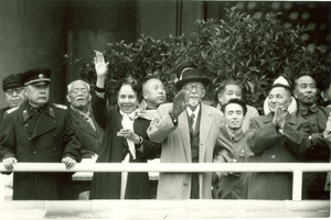 W. E. B. Du Bois, Shirley Graham Du Bois, Chen Yi, Deng Xiaoping and Chinese delegation greeting crowd during Anniversary Parade, Peking