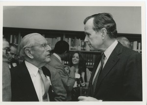 Vice president George Bush in conversation with an unidentified man at an ICD conference