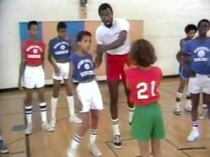 Tom Satch Sanders teaches basketball to African American children