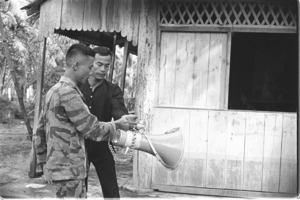 Captain Le Quang Chinh, commander of Luong Hoa garrison; Luong Hoa Village.