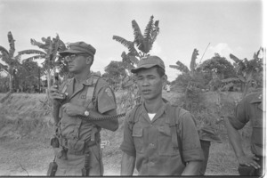 U.S. military advisor and Vietnamese radio at Hoa Hoa village; Long Xuyan Province.