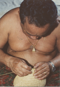 Basket Making: Em Yung threads the copper wire through the bamboo weave, 1987