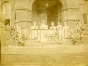 [Group of nurses on the stairs]