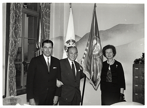 Two unidentified men and unidentified woman