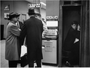 John F. Kennedy in phone booth, Boston, 1957