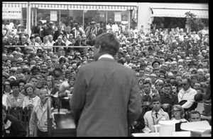 View from rear stage of Robert F. Kennedy speaking to a large crowd at the Turkey Day festivities
