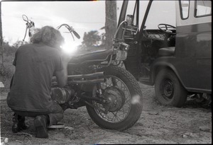 Man working on motorcycle