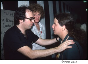 MUSE concert and rally: John Landau (left) talking to MUSE staff member with Tom Campbell in the background, backstage at the MUSE concert