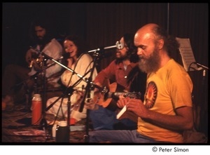 Ram Dass on stage with Amazing Grace