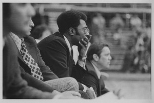 Ray Wilson, two unidentified people, and Jack Leaman watching a Minutemen basketball game in the Curry-Hicks Building