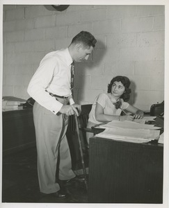 Dick Weir and woman at the office