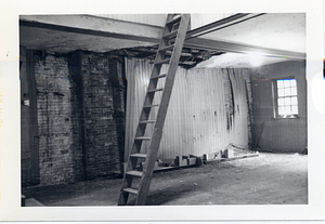 Ladder set up in the center of a room in the Parkman House