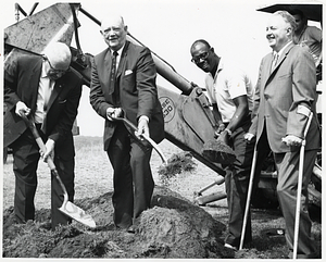 Mayor John F. Collins and three unidentified men digging at groundbreaking ceremony