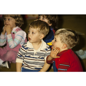 Young children attending a presentation