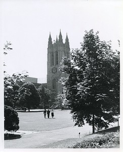 Gasson Hall exterior: bell tower from hill with female students walking