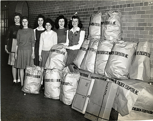 [Female students with The Children Federation, Inc. packages]