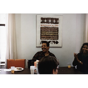 Ralph Ortiz laughing during an Inquilinos Boricuas en Acción staff meeting.