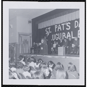 Donald M. DeHart addresses an audience of children at a Boys' Club of Boston St. Patrick's Day inaugural ball and exercises event