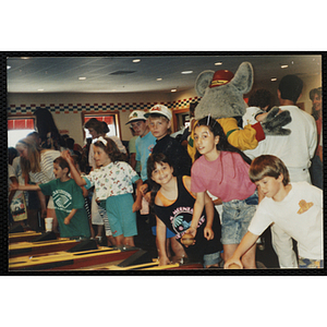 Children play skeeball at a Chuck E. Cheese's