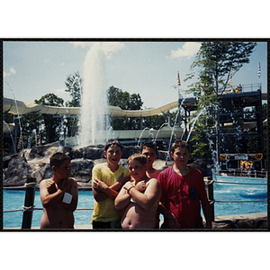 Five boys stand in front of a water slide at Water Country water park during a Tri-Club field trip