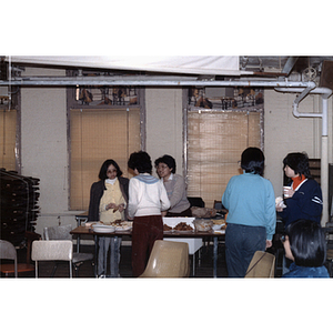 Guests and dinner at an International Women's Day event