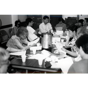 CPA members reading at a Workers' Center meeting