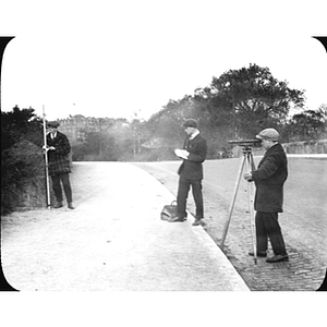 Engineering students survey a bridge near the Fens