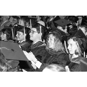 Graduates applaud during Law School commencement ceremony