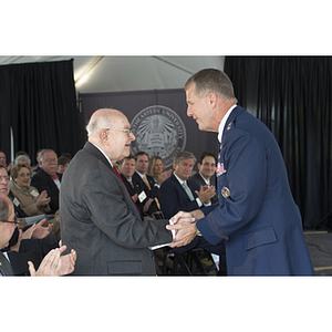 Dr. George J. Kostas shakes hands with Lieutenant General Ted F. Bowlds at the groundbreaking ceremony