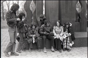 Richard Safft (reading) and other commune members during interview by Channel 5 news