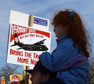 Child on her father's shoulders among the protesters on the National Mall, marching against the War in Iraq