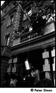 Umoja (Black student union) activists hoisting a television to occupiers of the administration building, Boston University