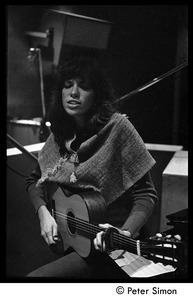Carly Simon playing guitar in the studio