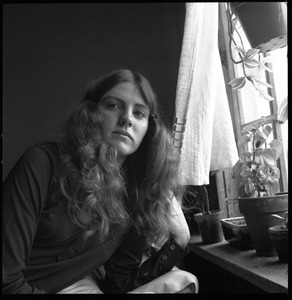 Unidentified woman commune member, sitting by the window, Brotherhood of the Spirit dormitory