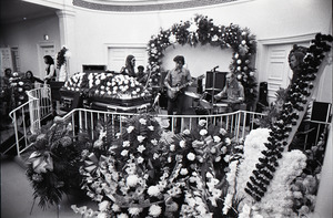 Duane Allman's funeral: musicians setting up with Duane Allman's casket in foreground, from left: Delaney Bramlett, Barry Oakley, Jaimoe, Dickey Betts, Butch Trucks, and Thom Doucette