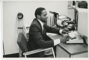 Man at desk doing clerical work