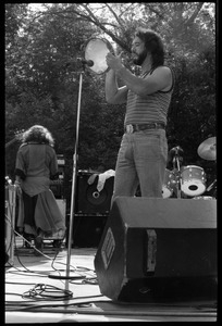 Airto Moreira on tambourine, Flora Purim (back to camera), and band performing at Jazz Festival, Hampshire College