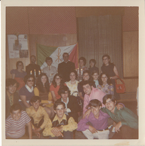 Group standing in front of Portuguese American Youth Group flag